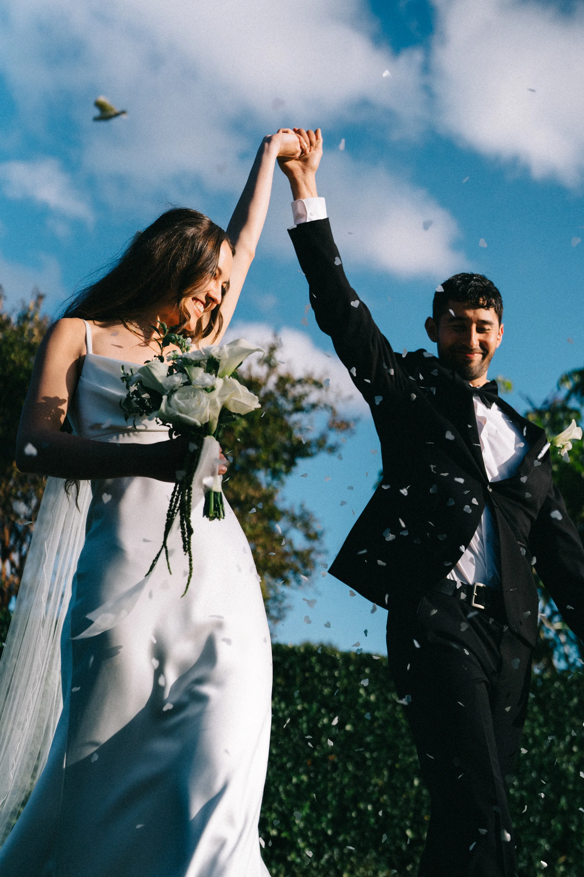 Just married, Luci & Carl, hands to the sky