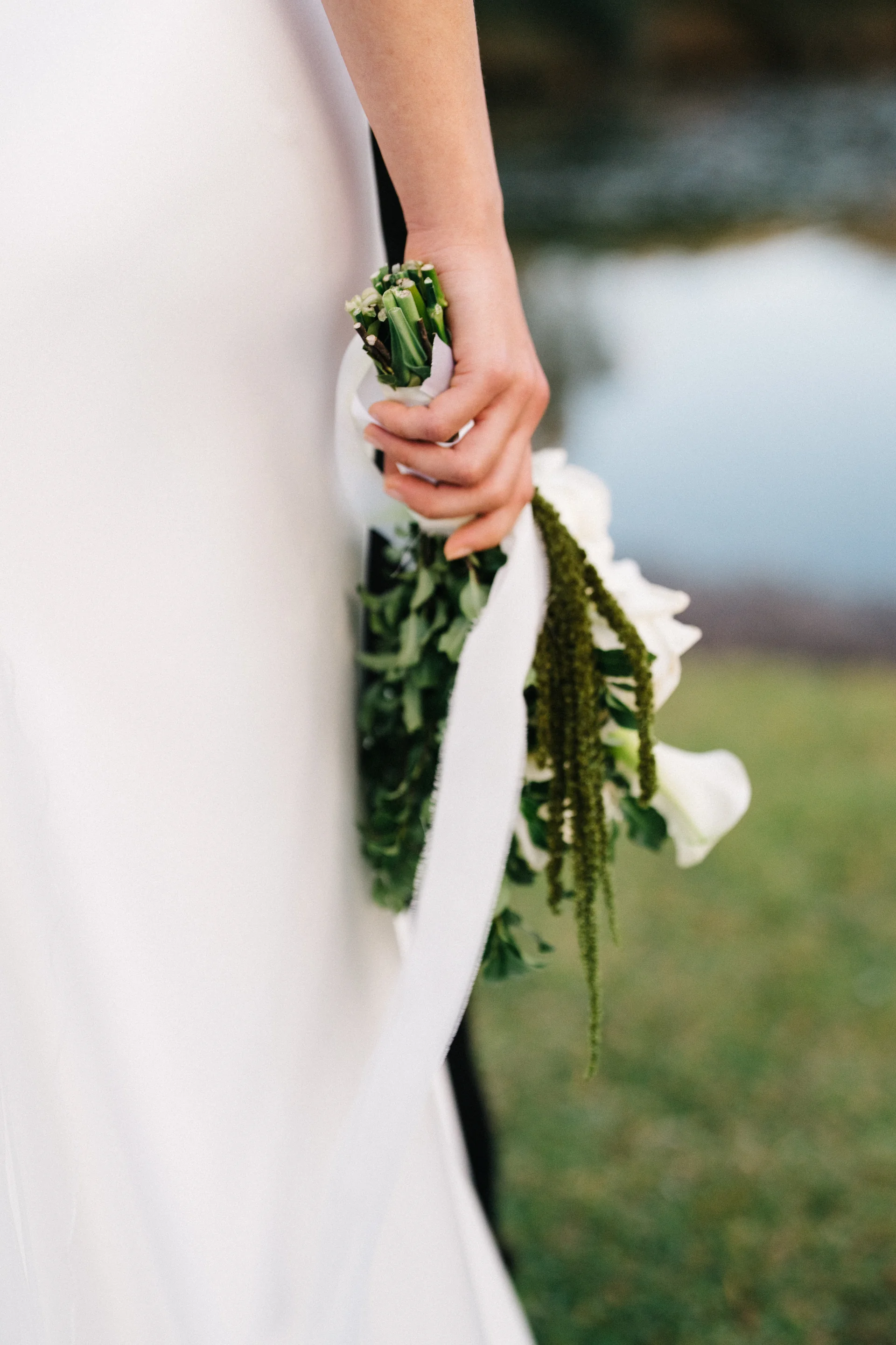 The bouquet, held low, Grass, water, white silk