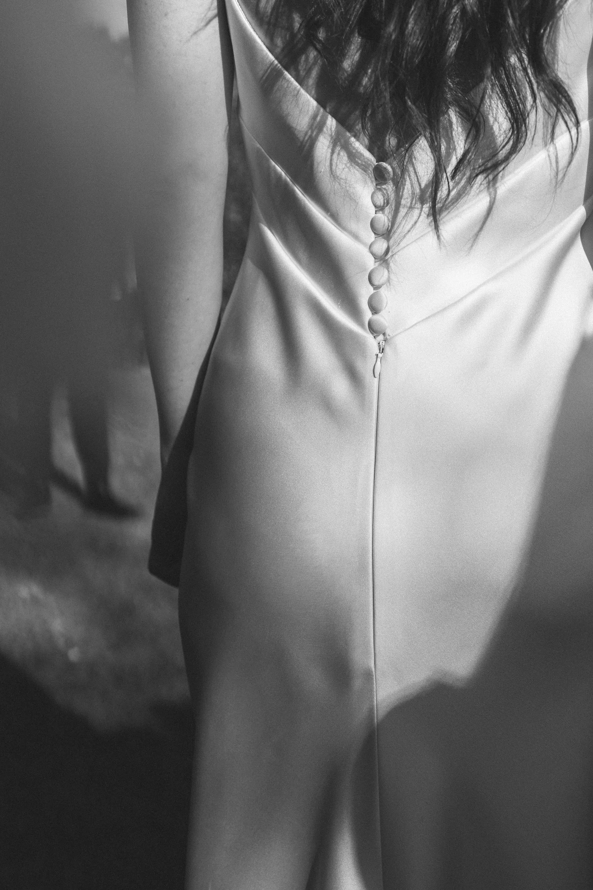 The buttons down the back, Silk, from behind