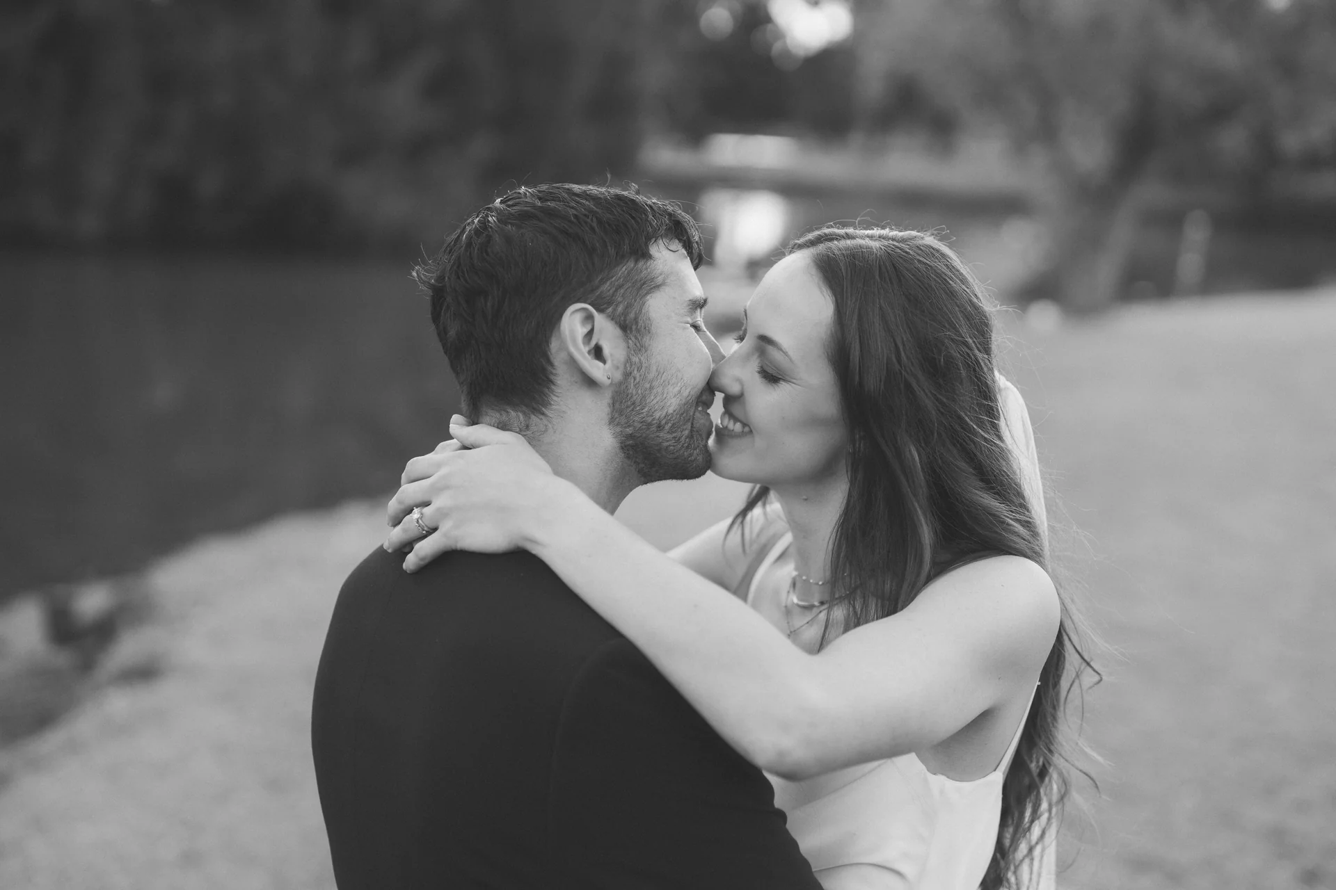 A wide, full-bleed photograph of a couple at their wedding, Sydney